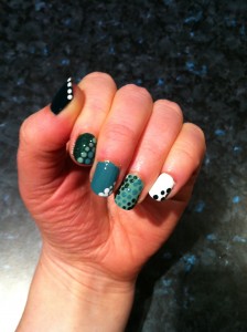 Green manicure with polka dots